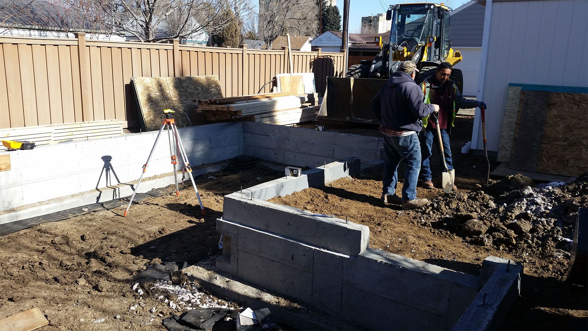 Crawl space foundation excavation and concrete footings for home addition in Denver