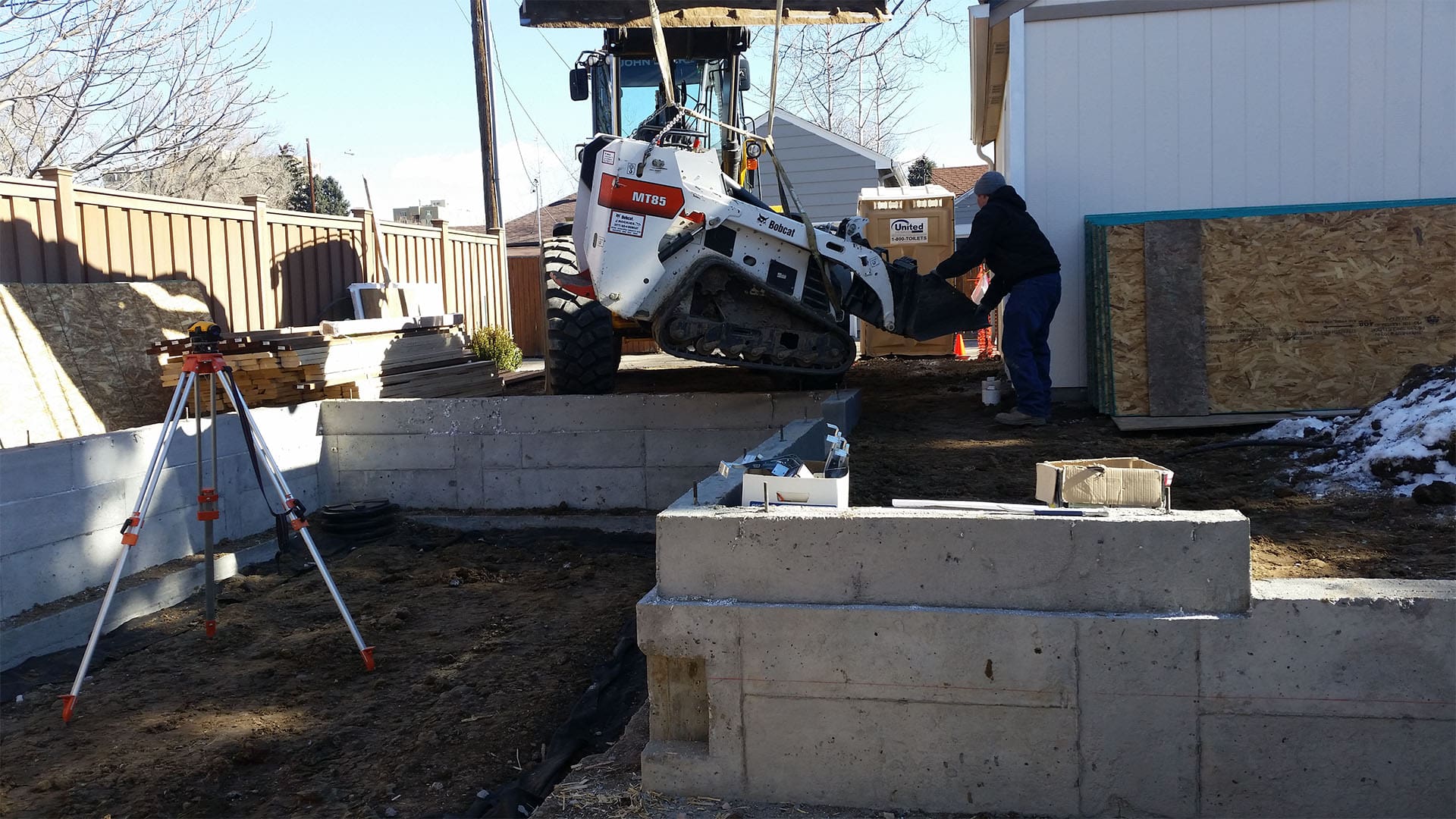 Crawl space foundation excavation and concrete footings for home addition in Denver