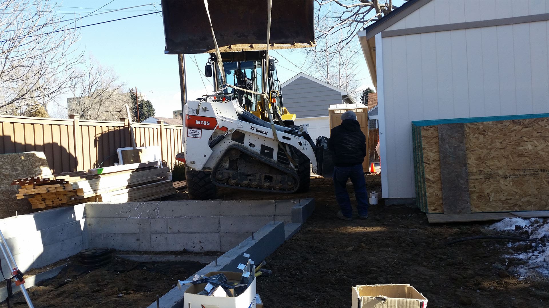 Crawl space foundation excavation and concrete footings for home addition in Denver