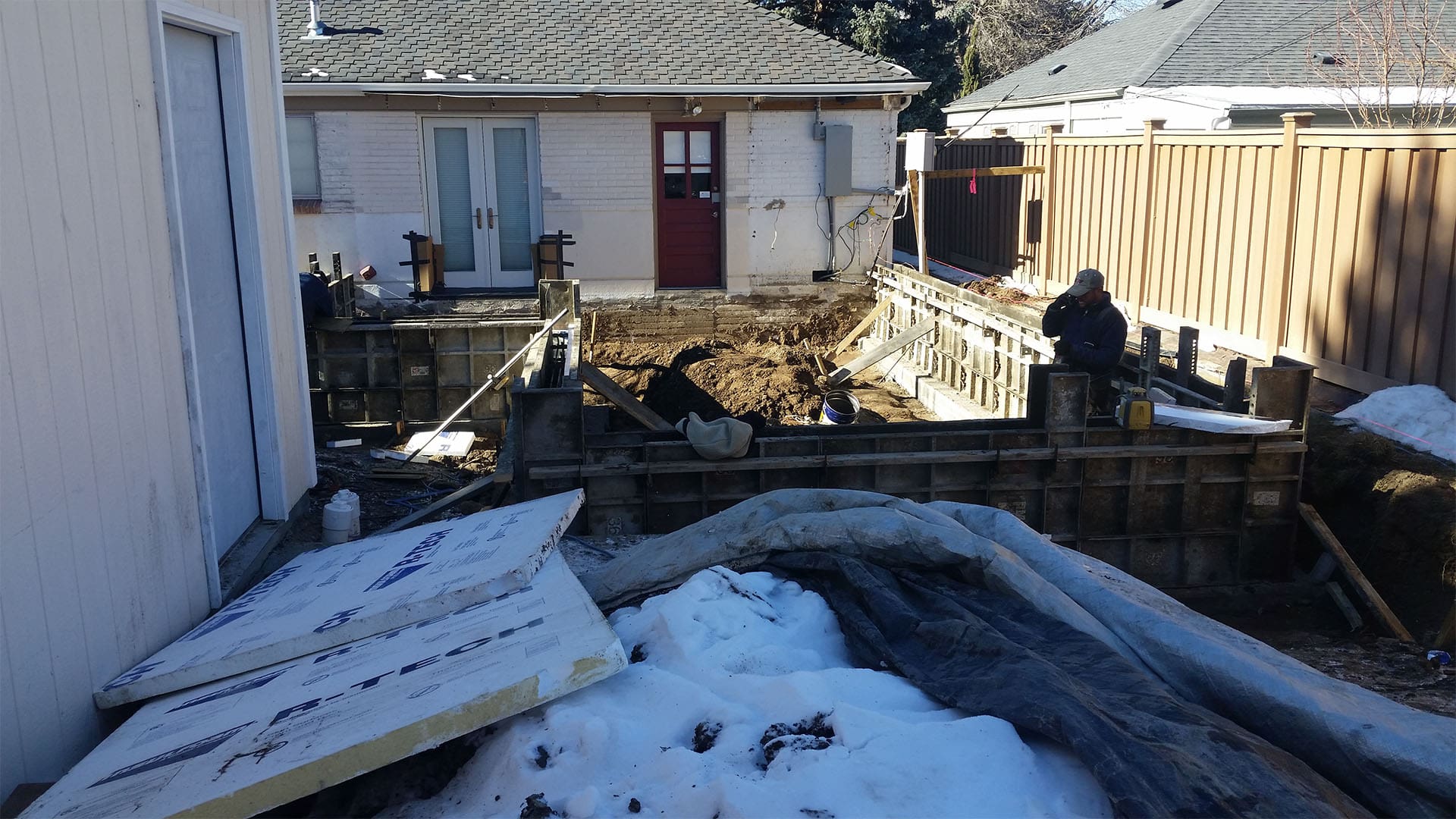 Crawl space foundation excavation and concrete footings for home addition in Denver