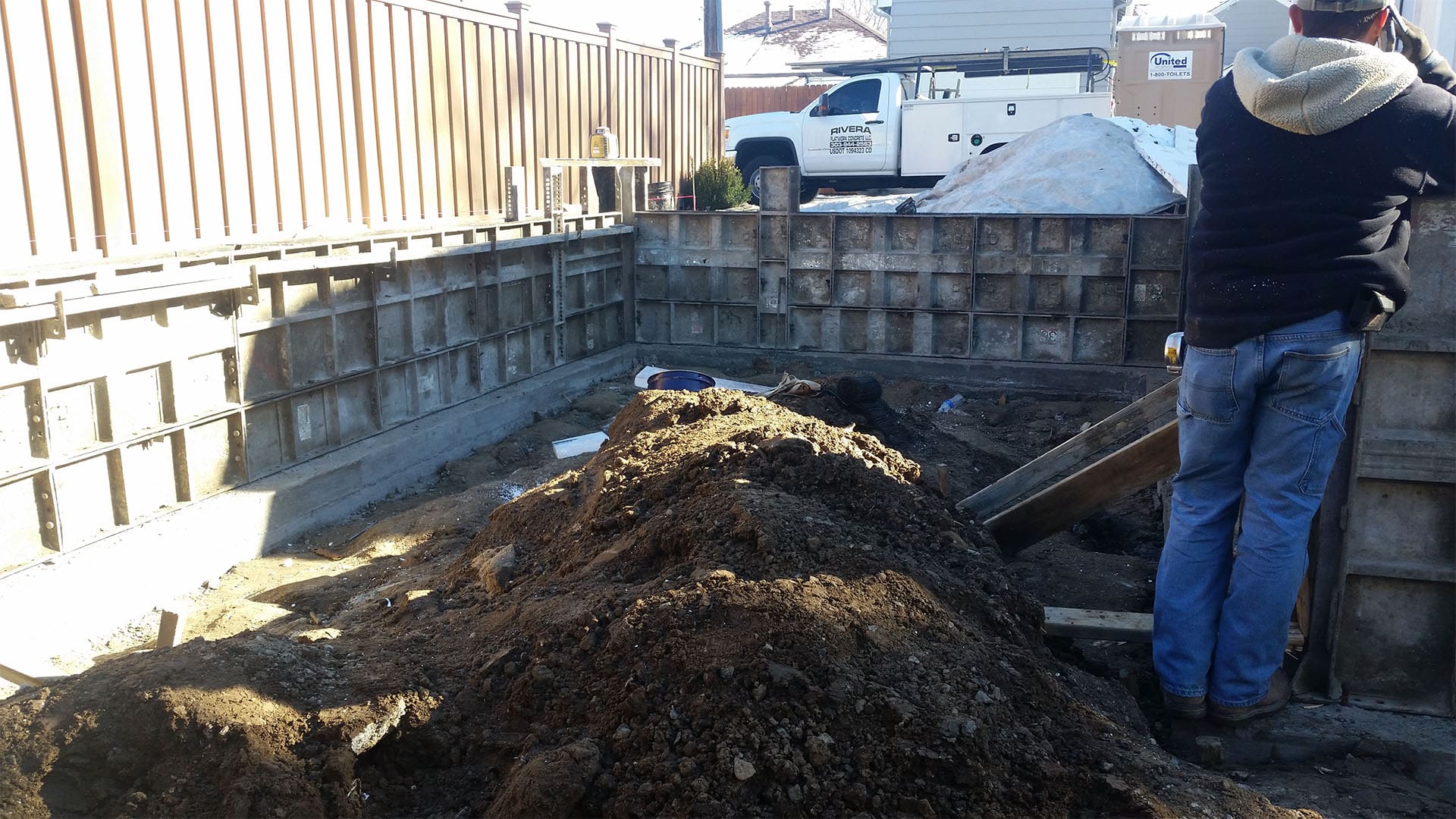 Crawl space foundation excavation and concrete footings for home addition in Denver