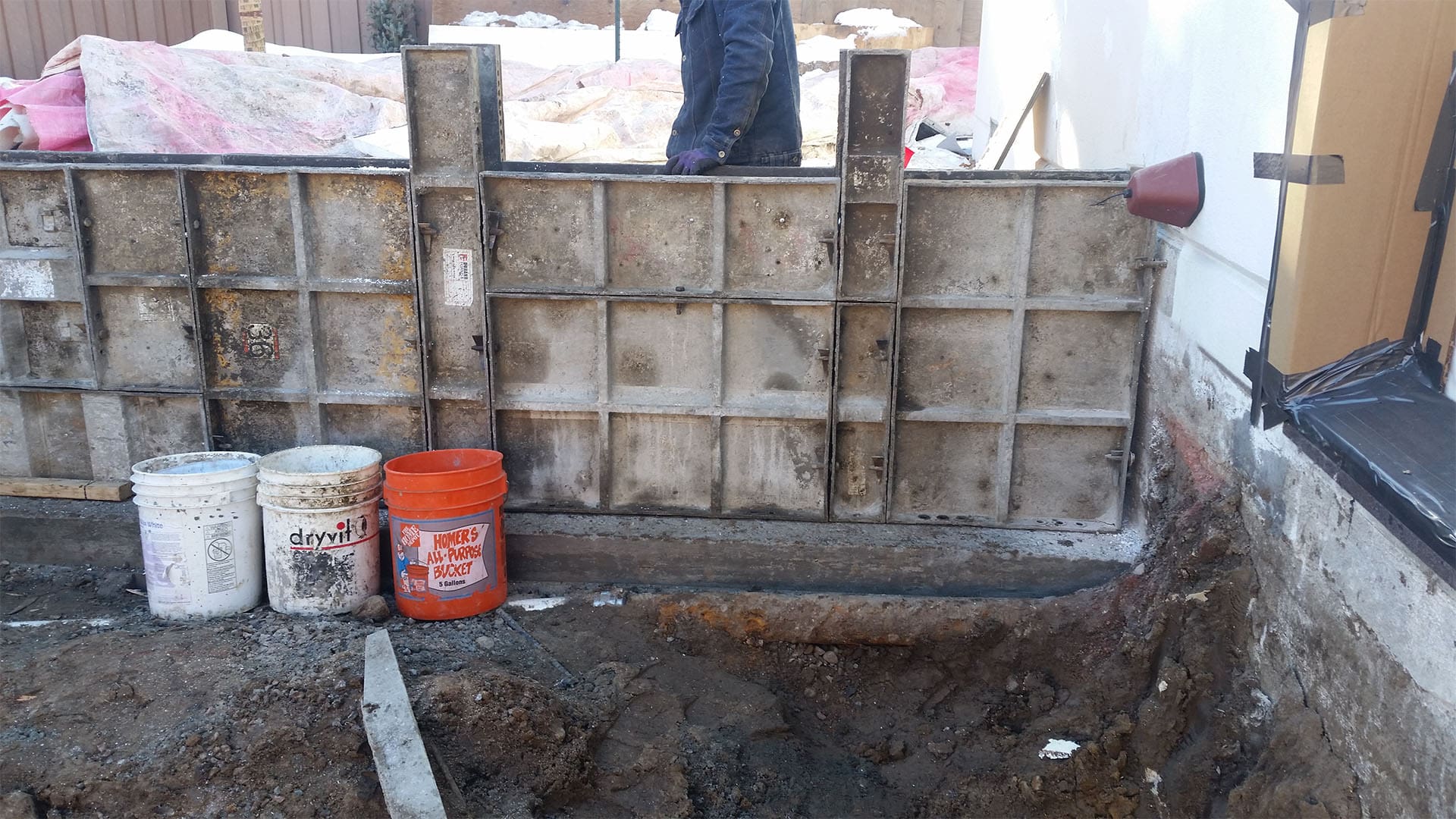 Crawl space foundation excavation and concrete footings for home addition in Denver