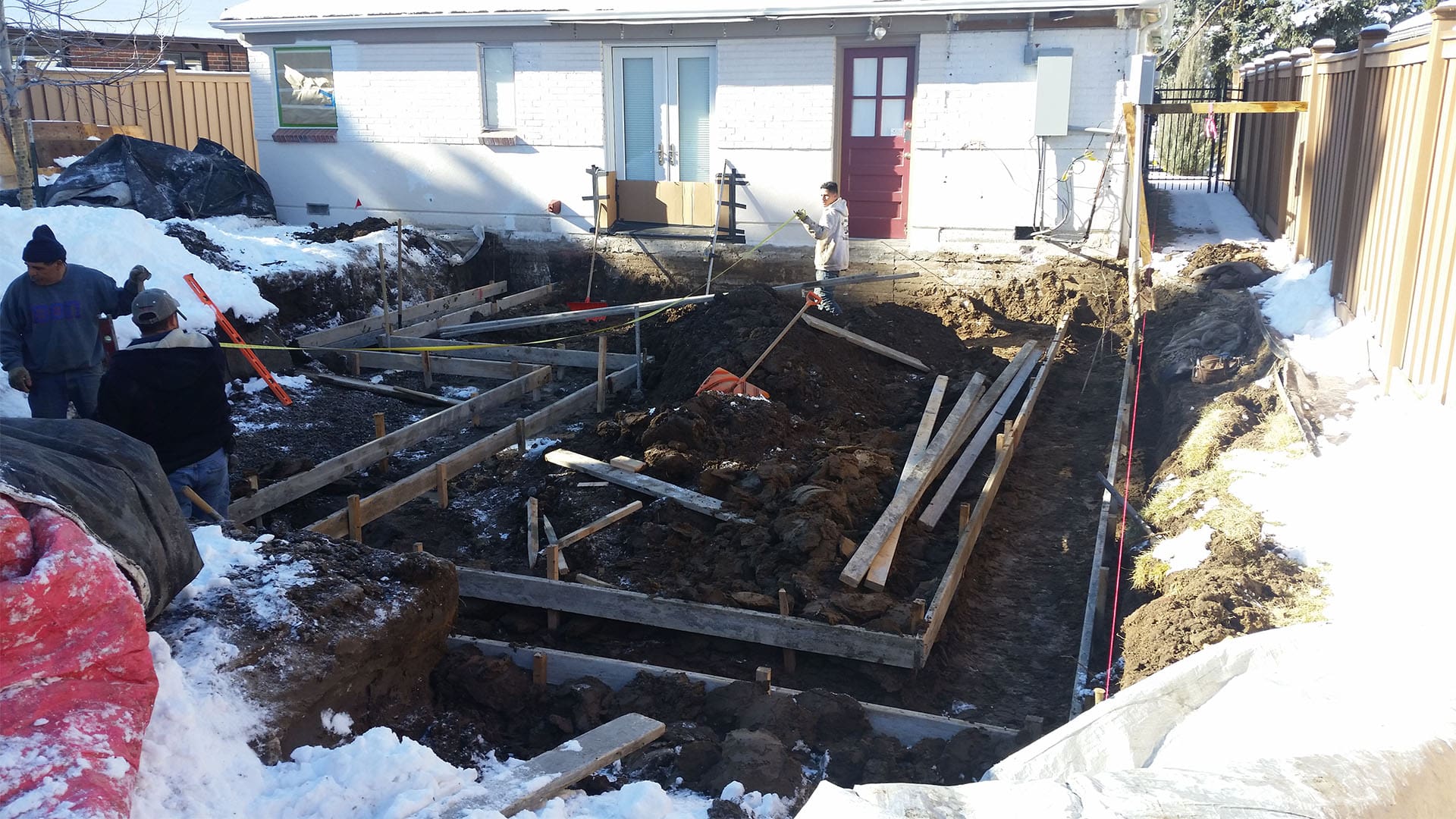 Crawl space foundation excavation and concrete footings for home addition in Denver