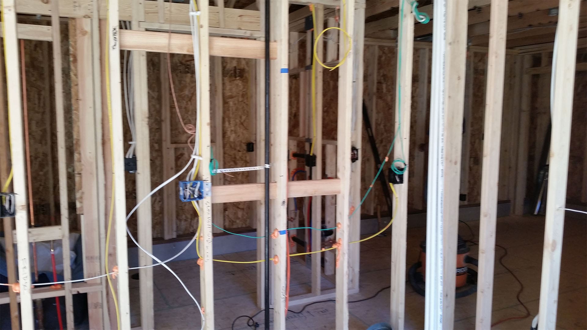 Framing walls and roof for Denver home addition at Raleigh Street